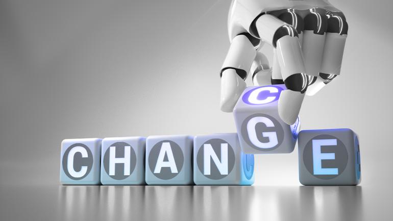 Bild zeigt das Wort Change. Eine Roboterhand tauscht den Buchstaben G in C um