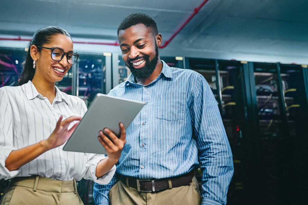 Two Consultants talking in front of servers