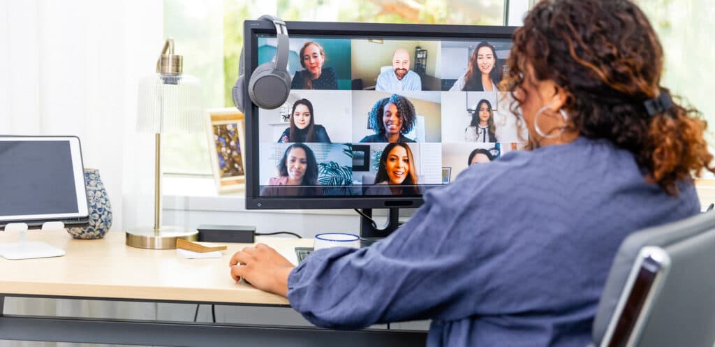 Professional participating in a remote TOGAF® Enterprise Architecture course remote via video conference, with multiple participants visible on screen.